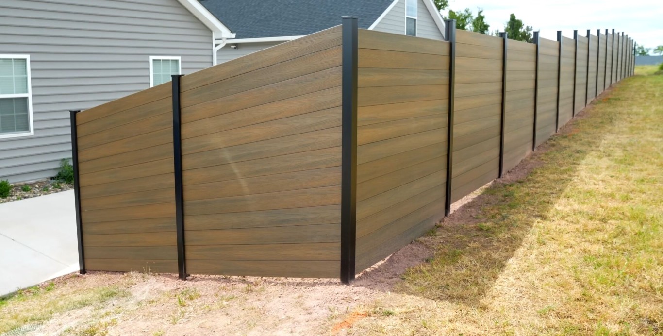 Privacy fence installation showing horizontal wood design in Torrington, CT